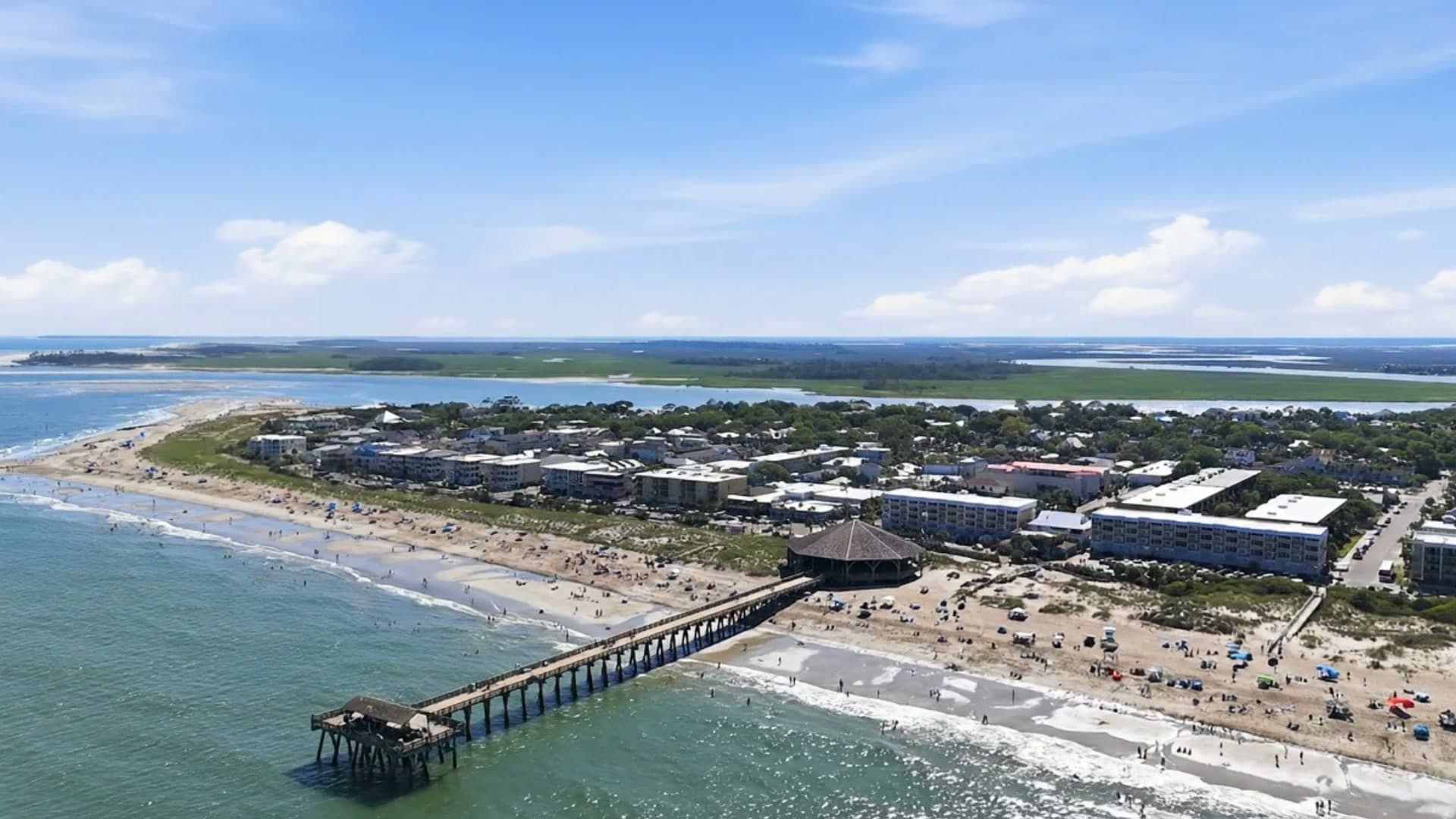 Aerial view of Tybee Island's beach, pier, and town on a clear day